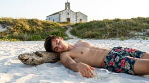 Shirtless_man_lying_on_beach_202608131230